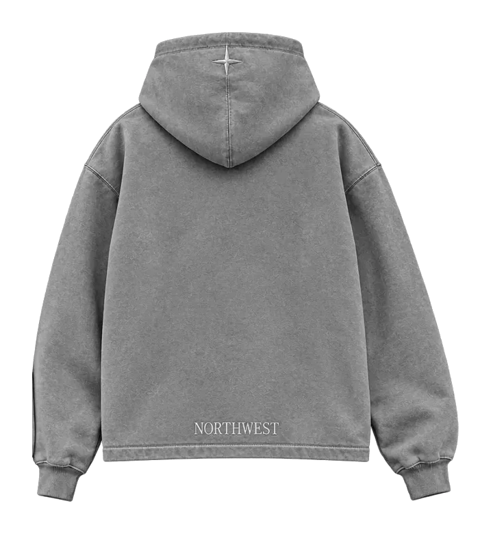 NORTHWEST hoodie in washed grey, back view: a tonal compass on the hood and the NORTHWEST wordmark across the back hem.